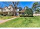 Charming townhome with stone accents, manicured lawn, and inviting walkway leading to the front door at 4139 N Course Dr, Charlotte, NC 28277