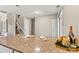 Granite countertop island with decorative candle and wine bottle details for an inviting culinary space at 4139 N Course Dr, Charlotte, NC 28277