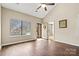 Bright living room with hardwood floors and a large window providing natural light at 4139 N Course Dr, Charlotte, NC 28277