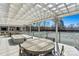 Outdoor patio with a tennis court view and ample seating space, perfect for relaxing or entertaining at 4139 N Course Dr, Charlotte, NC 28277