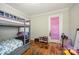 Bedroom featuring a gray bunk bed and wood floors at 421 N Tradd St, Statesville, NC 28677