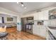 Well-lit kitchen featuring stainless steel appliances and white cabinetry at 421 N Tradd St, Statesville, NC 28677