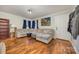 Inviting living room with hardwood floors, a comfortable sectional sofa, and bright natural light at 421 N Tradd St, Statesville, NC 28677