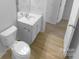 This bathroom features a modern sink, updated fixtures, and a clean aesthetic at 4219 Robinwood Dr, Charlotte, NC 28212