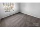 Cozy bedroom with a large window offering plenty of natural light at 4219 Robinwood Dr, Charlotte, NC 28212