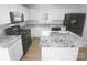 Modern kitchen features stainless steel appliances, granite countertops, and a center island at 4219 Robinwood Dr, Charlotte, NC 28212
