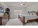 Cozy bedroom features plush carpeting, a window with backyard views, and a warm color scheme at 4720 Maiden Creek Way, Maiden, NC 28650