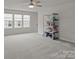 Bonus room featuring neutral carpeting, natural light and display shelving at 4720 Maiden Creek Way, Maiden, NC 28650