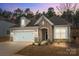 Charming single-Gathering home boasts stone accents, a two-car garage, and a welcoming front entrance at 4720 Maiden Creek Way, Maiden, NC 28650