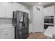 Stainless steel refrigerator with water dispenser stands out against the white cabinets and subway tile at 4720 Maiden Creek Way, Maiden, NC 28650