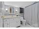 Cozy bathroom featuring a white vanity with a countertop, a toilet, and a shower with a decorative curtain at 5084 Mariana Ct, Tega Cay, SC 29708