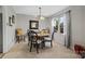 Cozy dining area with round table, elegant chairs, and soft natural lighting at 5084 Mariana Ct, Tega Cay, SC 29708
