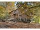 View of the rustic home showcasing its wood exterior and cozy porch at 5084 Mariana Ct, Tega Cay, SC 29708