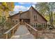 Charming wood home with a long, elevated walkway leading to the front porch at 5084 Mariana Ct, Tega Cay, SC 29708