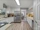 Spacious kitchen with stainless steel refrigerator and a breakfast nook with a view at 5084 Mariana Ct, Tega Cay, SC 29708