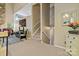 Bright living room featuring stairs, neutral carpet, and a glimpse of cozy furnishings at 5084 Mariana Ct, Tega Cay, SC 29708