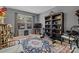 A beautifully decorated living room featuring a fireplace, large window, and exercise bench at 5084 Mariana Ct, Tega Cay, SC 29708