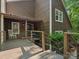 Inviting deck with rocking chair, featuring access to the front door and overlooking lush greenery at 5084 Mariana Ct, Tega Cay, SC 29708