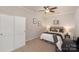 Bedroom featuring a ceiling fan, closet, and warm neutral colored walls at 620 Amethyst Cir, Fort Mill, SC 29708