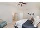 Bright bedroom featuring a ceiling fan, carpet floors, and ensuite bathroom at 620 Amethyst Cir, Fort Mill, SC 29708