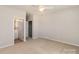 Bedroom with neutral paint, carpet, and access to a walk in closet at 620 Amethyst Cir, Fort Mill, SC 29708
