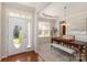 Inviting dining area boasting a stylish table and chair set, complemented by a bright front door and interior design at 620 Amethyst Cir, Fort Mill, SC 29708