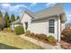 Well-maintained home exterior with lush landscaping and a sidewalk at 620 Amethyst Cir, Fort Mill, SC 29708