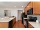 Kitchen featuring tile backsplash, stainless steel appliances and hardwood floors at 620 Amethyst Cir, Fort Mill, SC 29708