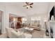 Spacious living room with open layout to kitchen, a fireplace, cozy seating, and plenty of natural light at 620 Amethyst Cir, Fort Mill, SC 29708