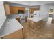 Functional kitchen with modern appliances, ample counter space, and an island for food preparation at 6318 Pink Dogwood Ln, Charlotte, NC 28262