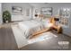 Serene main bedroom featuring a plush bed, tasteful decor, and plenty of natural light at 6318 Pink Dogwood Ln, Charlotte, NC 28262