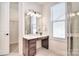 Elegant bathroom with a vanity, storage drawers, a large mirror, and natural light at 6521 Shoff Cir, Charlotte, NC 28215