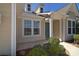 Inviting home entrance featuring a covered porch, well-maintained landscaping, and natural light at 6521 Shoff Cir, Charlotte, NC 28215
