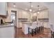 Modern kitchen with granite countertops, stainless steel appliances, and breakfast bar seating at 6521 Shoff Cir, Charlotte, NC 28215