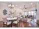 Open-concept living space featuring a dining table, living room, and plenty of natural light at 6521 Shoff Cir, Charlotte, NC 28215