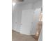 Bedroom features neutral carpet, closet, and an open door leading into the connected sitting area at 6809 Brancusi Ct, Charlotte, NC 28215