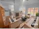 Bright and airy living room featuring a fireplace, hardwood floors, and large windows at 6809 Brancusi Ct, Charlotte, NC 28215