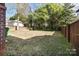 Backyard featuring grass, trees, and wooden fence at 732 Ellsworth Rd, Charlotte, NC 28211