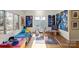 Cozy bedroom with hardwood floors, natural light, and unique artwork at 732 Ellsworth Rd, Charlotte, NC 28211