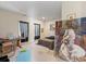 Comfortable bedroom featuring natural light, hardwood flooring, and contemporary artwork at 732 Ellsworth Rd, Charlotte, NC 28211