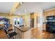 Cozy kitchen featuring a kitchen island, stainless steel appliances, and hardwood flooring at 732 Ellsworth Rd, Charlotte, NC 28211