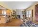 Spacious living room with hardwood floors, a fireplace, and an open concept kitchen at 732 Ellsworth Rd, Charlotte, NC 28211