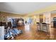 Spacious area featuring hardwood floors, a kitchenette, and abundant natural light at 732 Ellsworth Rd, Charlotte, NC 28211