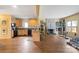Bright and airy living room featuring an open kitchen, fireplace, and hardwood floors at 732 Ellsworth Rd, Charlotte, NC 28211