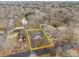 Aerial view of property showcasing the house and surrounding neighborhood with mature trees at 805 East St, Albemarle, NC 28001