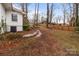 Spacious backyard with a brick-lined pathway and a classic wooden fence at 805 East St, Albemarle, NC 28001