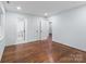 Bedroom featuring hardwood floors, multiple closets, and an attached bathroom at 805 East St, Albemarle, NC 28001
