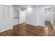 Bedroom boasts hardwood floors and white trim, with built-in shelves and closet at 805 East St, Albemarle, NC 28001
