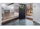 Inviting entryway featuring stone flooring, a wooden staircase, and a view into the living room at 805 East St, Albemarle, NC 28001