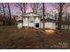 Inviting two-story home with a crisp white facade, front door, and stone walkway at 805 East St, Albemarle, NC 28001